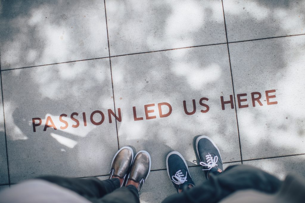 How to create a good brand story - Passion led us hear written on sidewalk